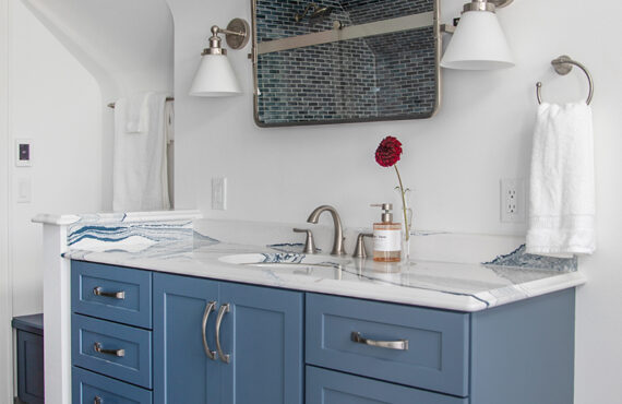 Bathroom with blue cabinetry