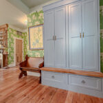 Light blue tall storage cabinet with bench seating