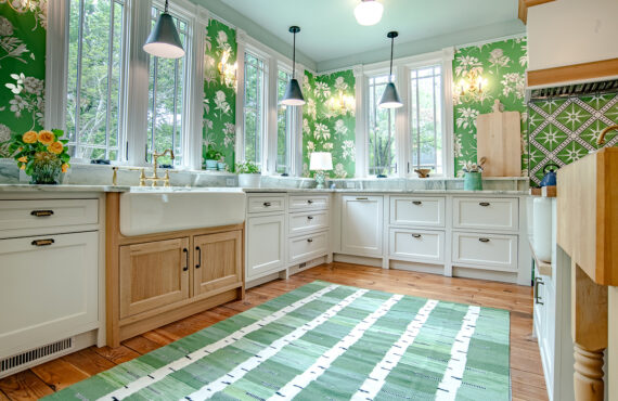 White kitchen cabinets with natural rift white oak apron sink.