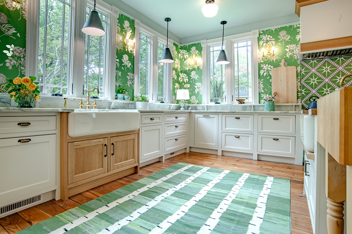 White kitchen cabinets with natural rift white oak apron sink.