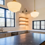 Light beige kitchen cabinets with hood and floating shelves.