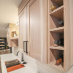 Contemporary kitchen with cabinets in light stain.