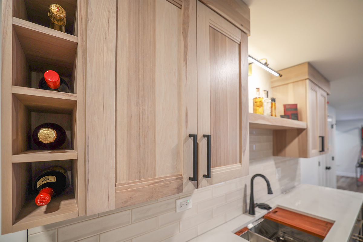 Contemporary kitchen with cabinets in light stain.