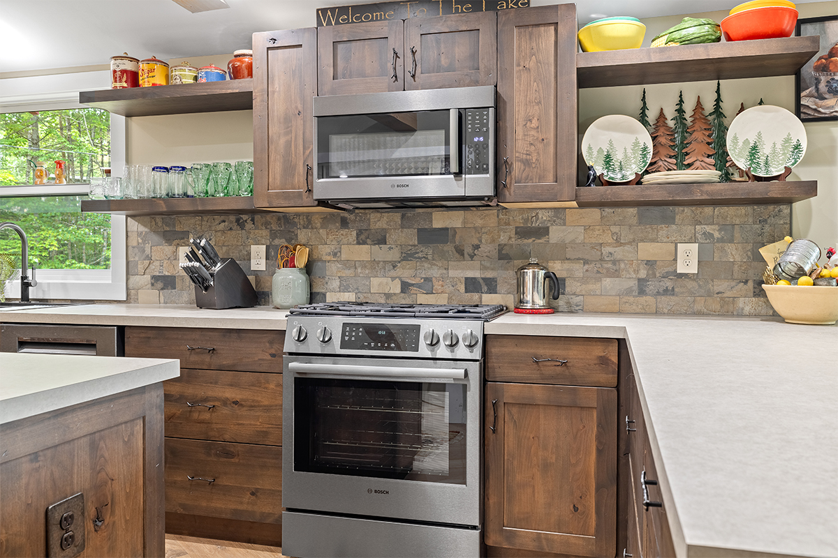 Rustic Alder kitchen with ceiling beams and floating shelves.