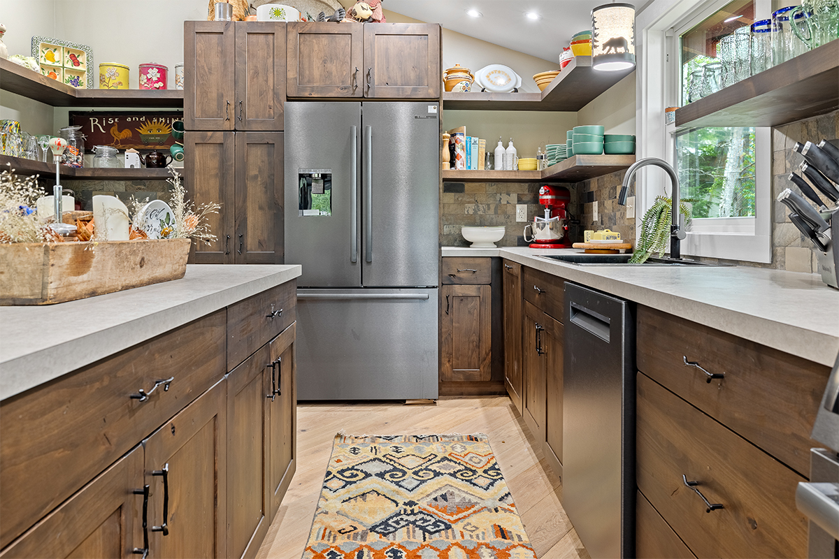 Rustic Alder kitchen with ceiling beams and floating shelves.
