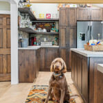 Rustic Alder kitchen with ceiling beams and floating shelves.