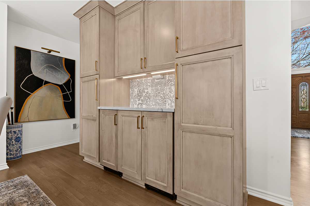 Kitchen cabinets with light brown stain.