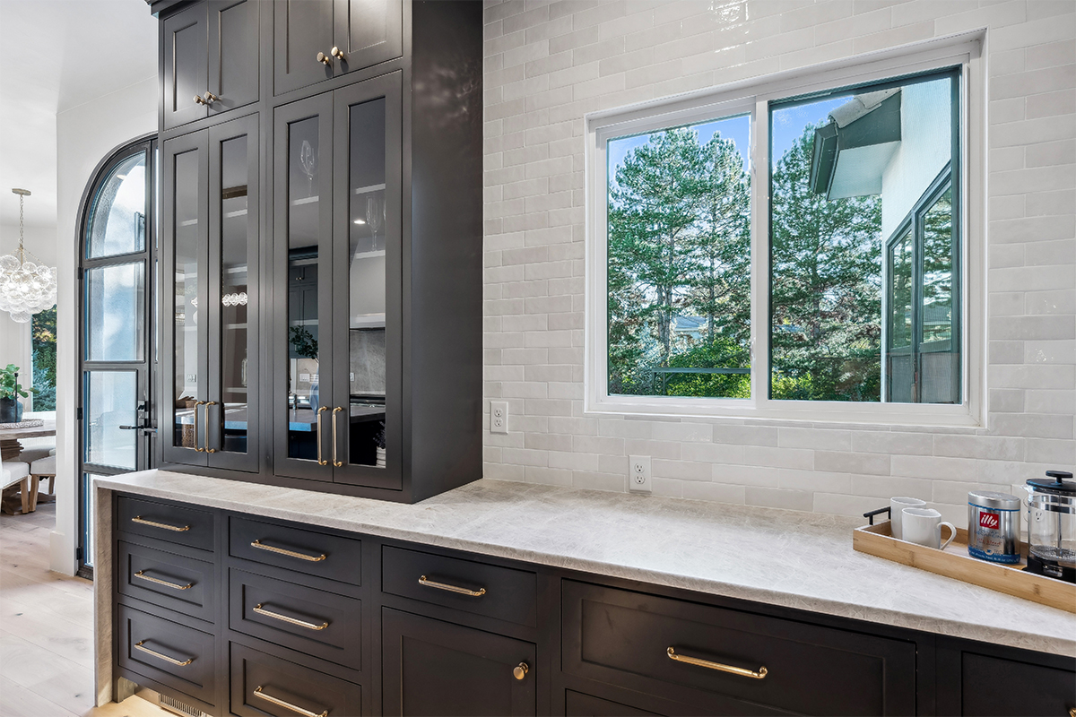 Kitchen with dark Iron Ore painted cabinets.