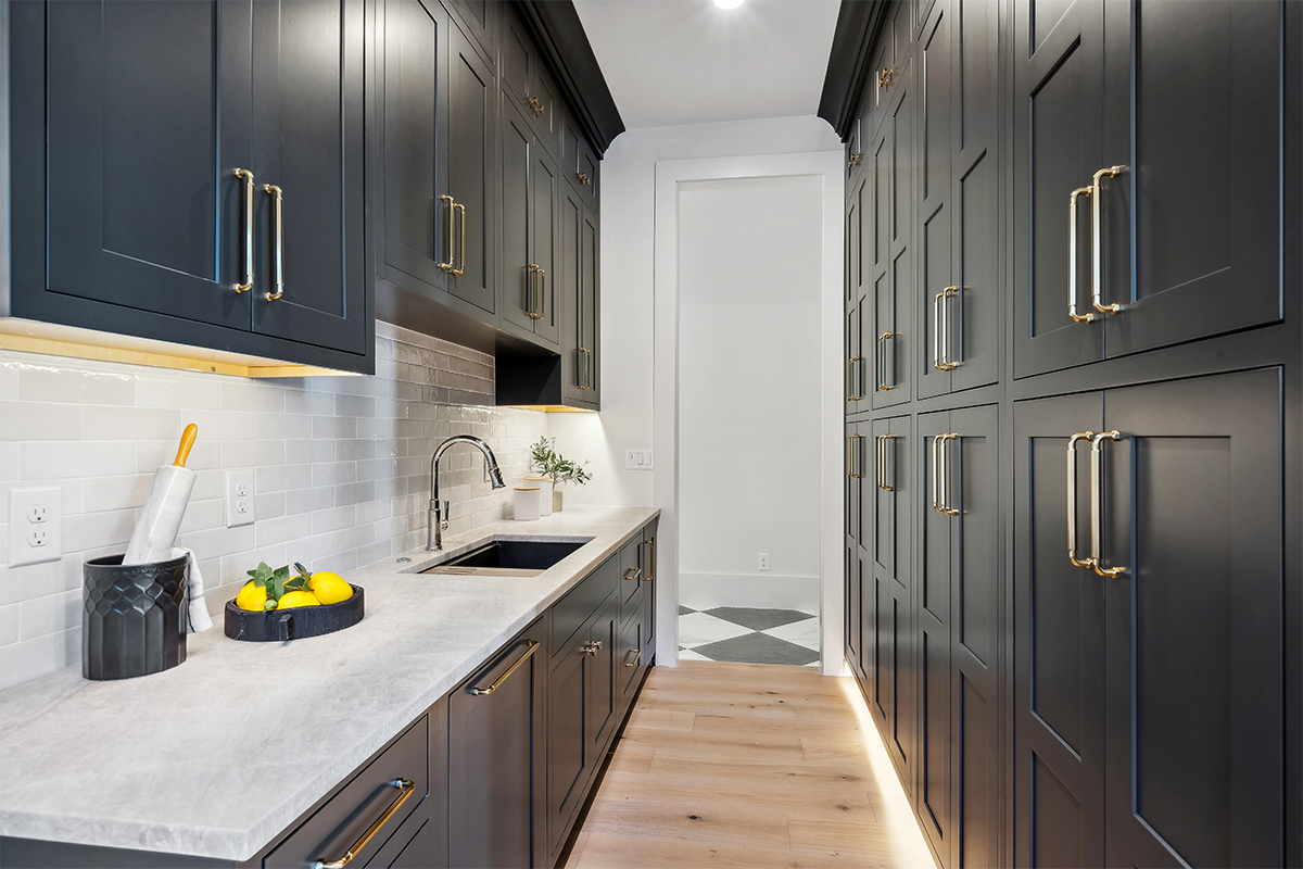 Kitchen with dark Iron Ore painted cabinets.