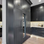 Kitchen with dark Iron Ore painted cabinets.