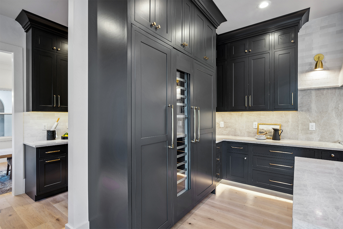 Kitchen with dark Iron Ore painted cabinets.