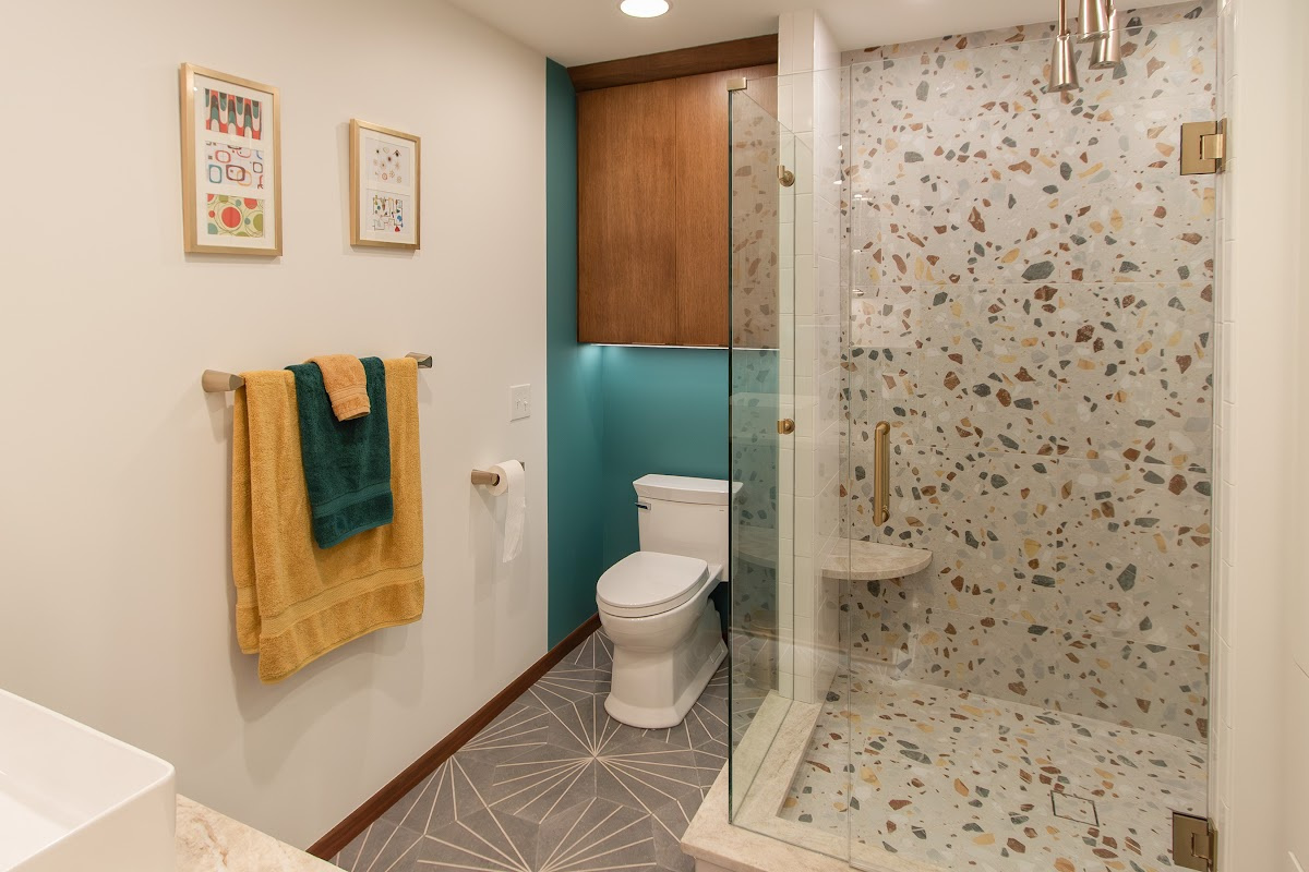 Bathroom with a stained wall cabinet above the toilet.