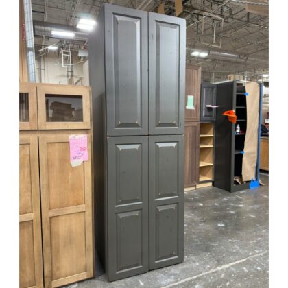 Dark gray painted utility cabinet in a manufacturing facility