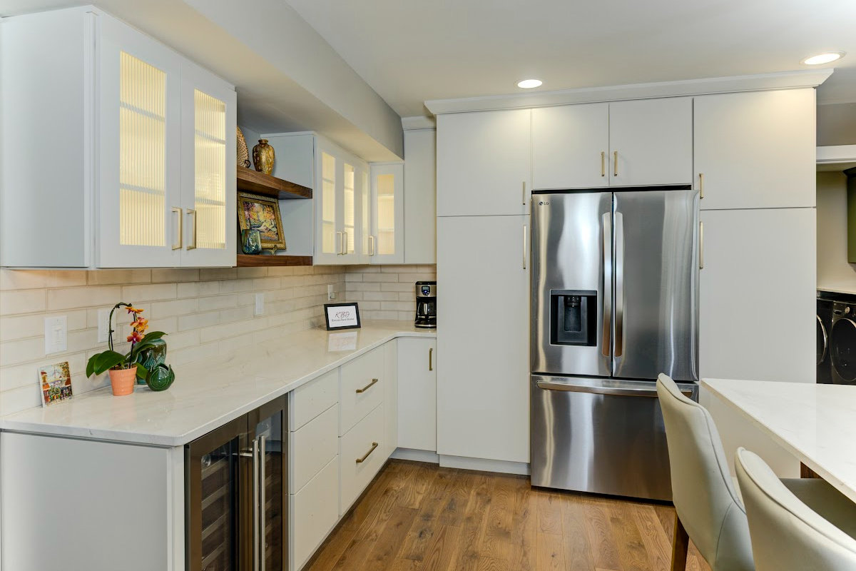 White painted kitchen cabinets with island seating