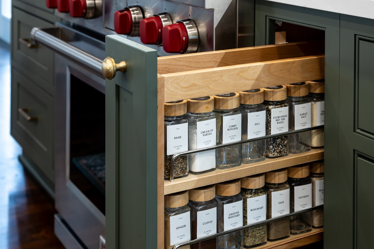 Spice pullout base with green painted door and spice bottles shown.