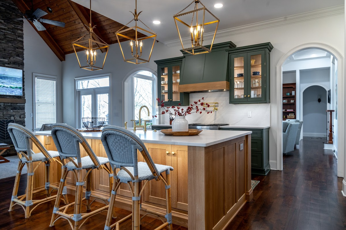 Green and white oak kitchen cabinets and island.