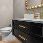 Dark green painted floating vanity with two drawer look in a bathroom.