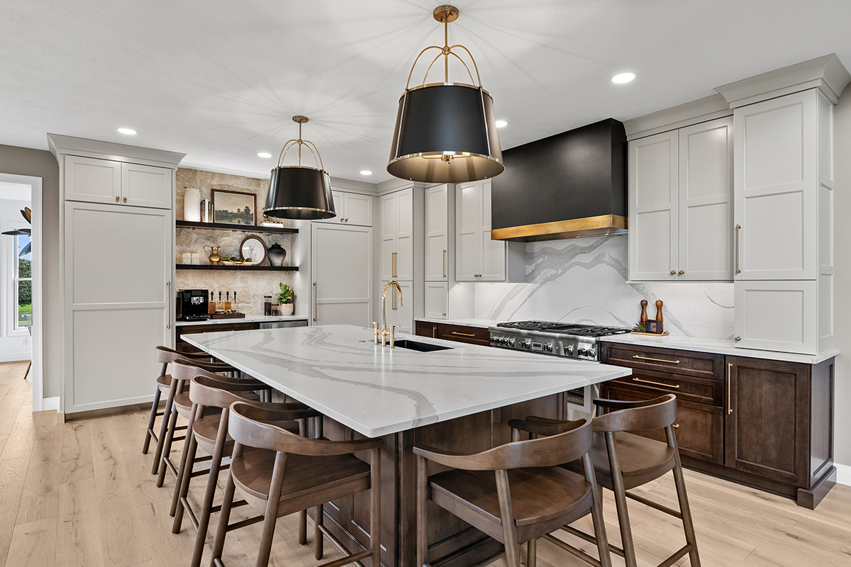 White and dark stained kitchen cabinets with white counter.