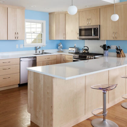 Modern Mid-Century kitchen with slab doors in maple natural