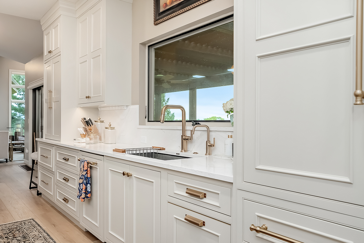 Beige painted bar cabinets with mullion doors