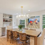 White painted bar cabinets in a dining room.