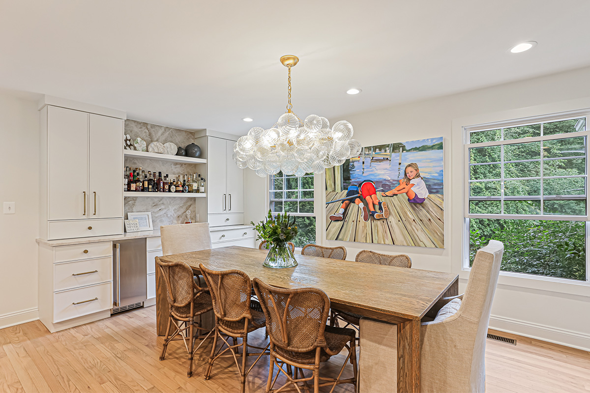 White painted bar cabinets in a dining room.