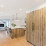 Ginger surface island cabinets and fridge panels.