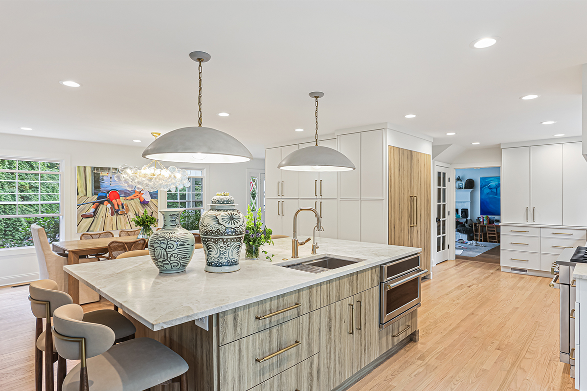 White painted kitchen cabinets with an island in the Ginger textured melamine surface with grains.