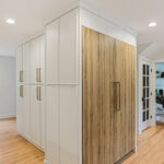 Ginger surface fridge panels and white painted kitchen cabinets.
