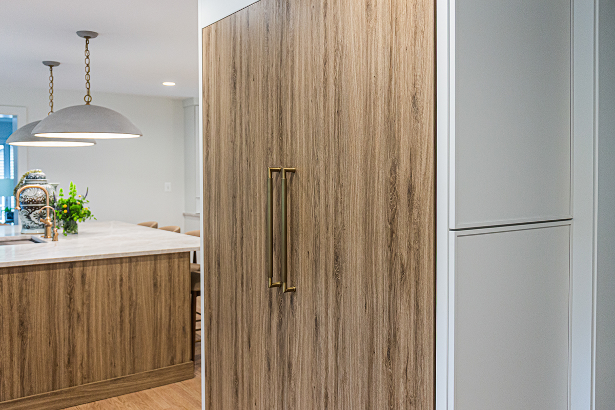 Ginger surface island cabinets and fridge panels.